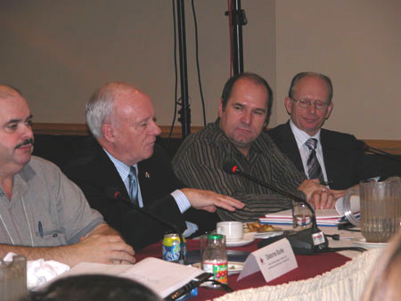 (L-R) Osborne Burke, Harbour Authority of Ingonish, NS; Minister Loyola Hearn; Luc Legresley, Harbour Authority of Newport, QC; Cal Hegge, ADM HRCS — at the National Harbour Authority Advisory Committee meeting held last November 