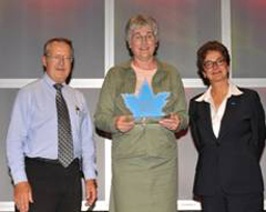 On behalf of the Network, Charlene Elgee (centre) accepted the award from Borys Koba, CIO of Citizenship and Immigration, and Corinne Charette, CIO for the Government of Canada.