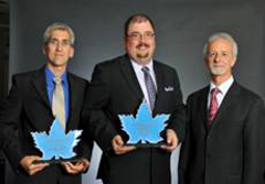Transport Canada recipients Stéphane Thibodeau and Pierre-Louis Ponton with André Morency.